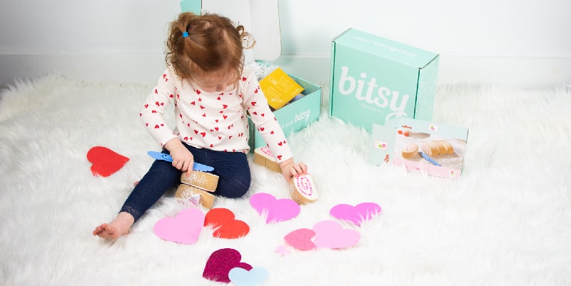 little girl playing on the floor